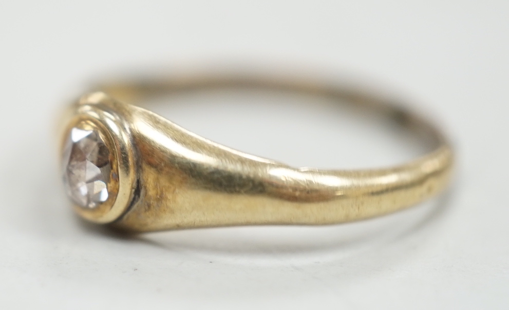 An antique yellow metal and single stone rose cut diamond set ring, size N, gross weight 1.1 grams.